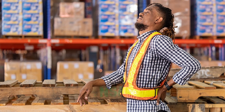 Warehouse worker with back pain