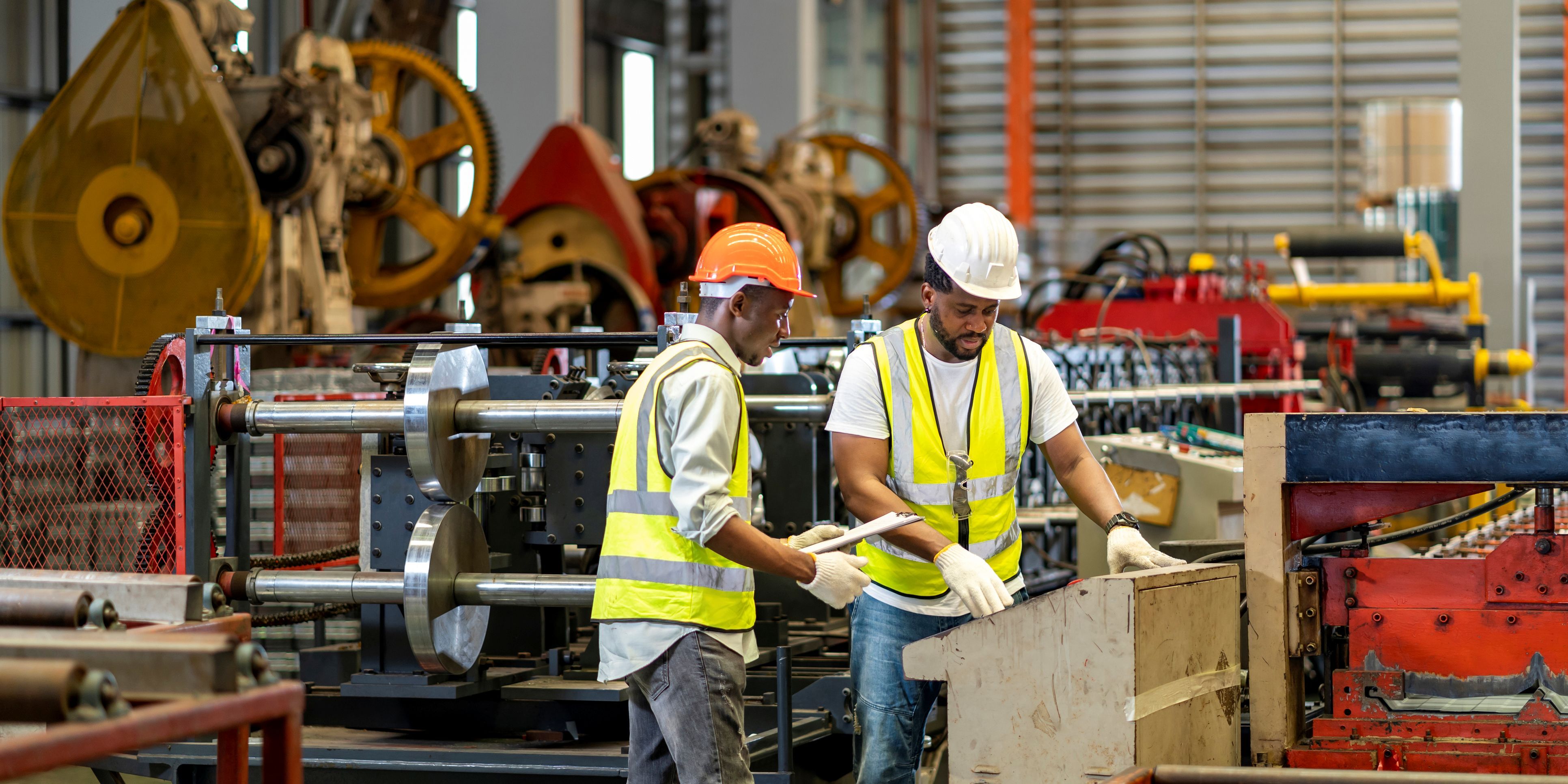 2 men working in factory